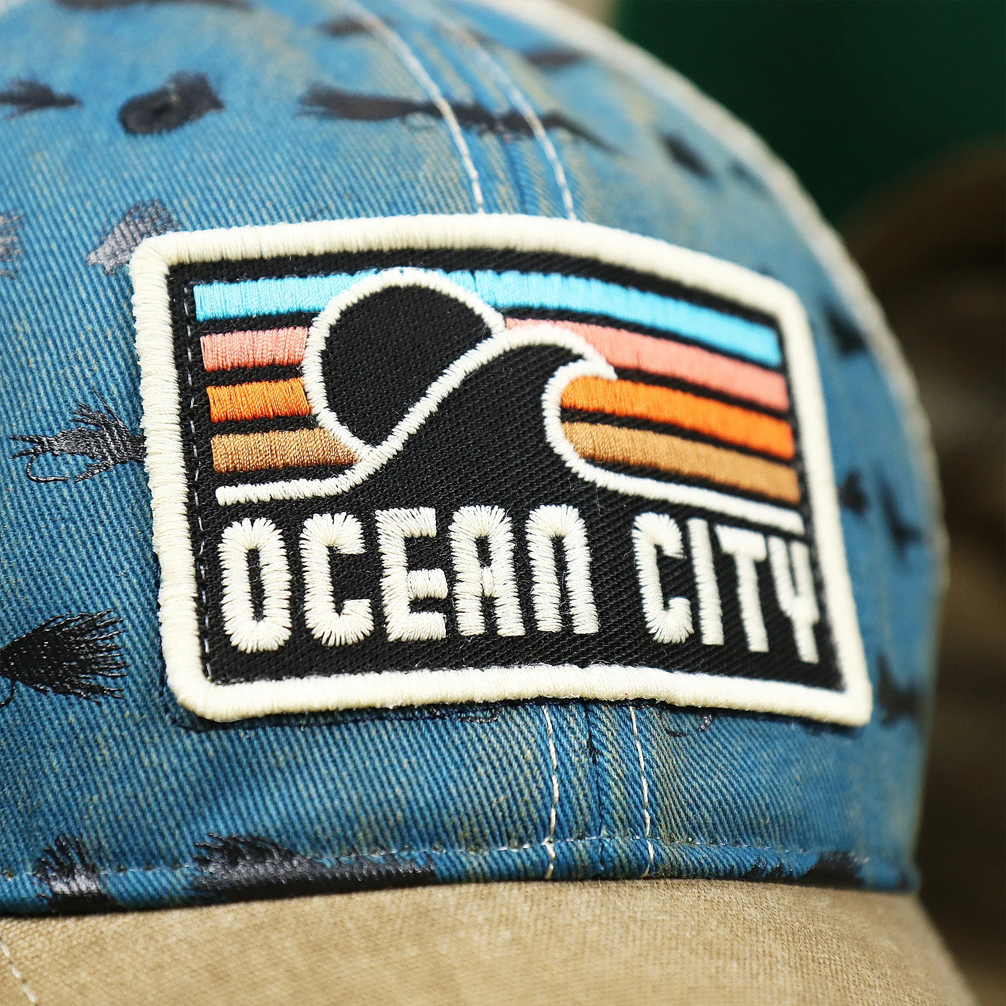 Ocean City Sunset Patch Fishing Lure Print Mesh Back Trucker Hat | Marine Blue Trucker Hat